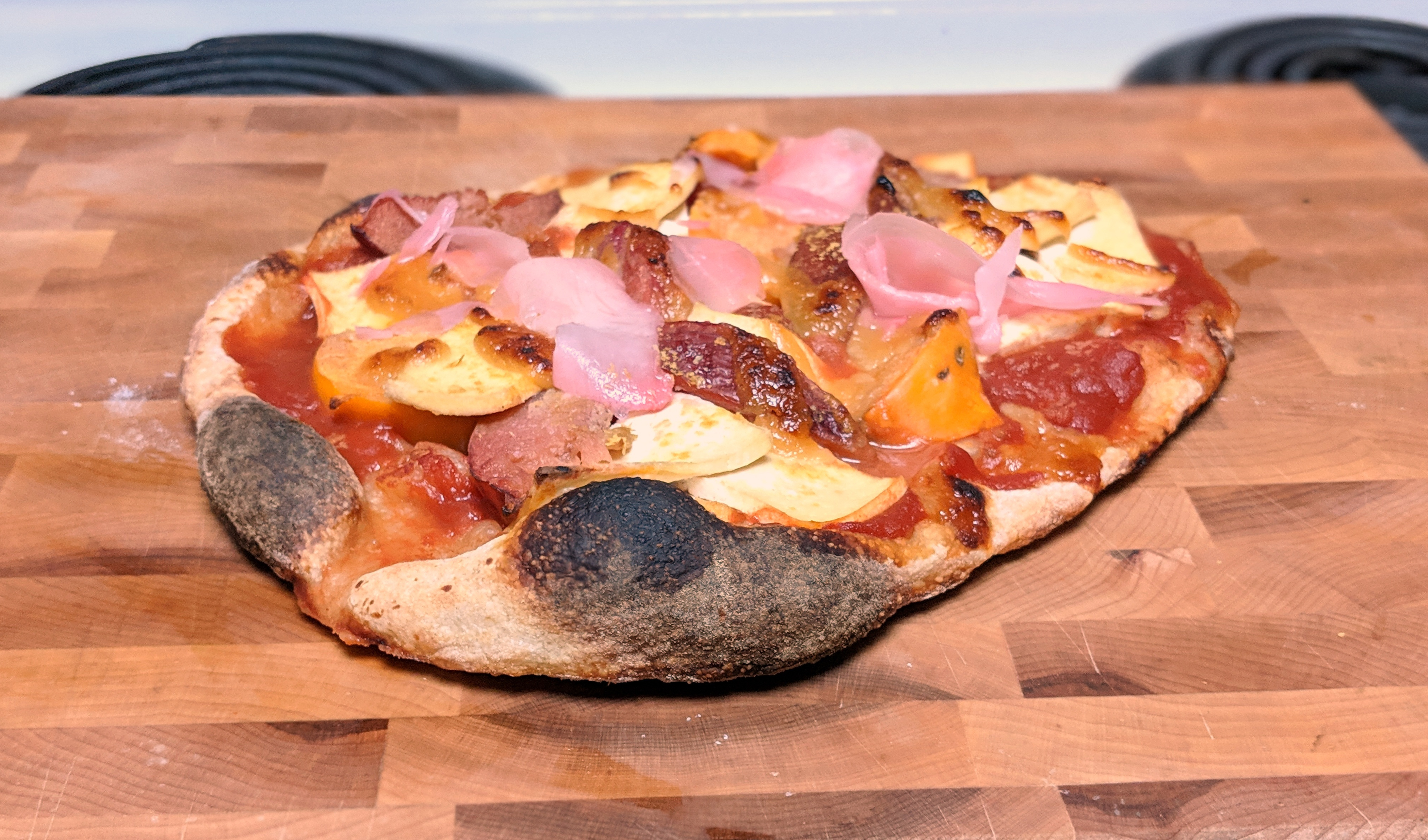 Pizza with lactofermented plums and fuyu